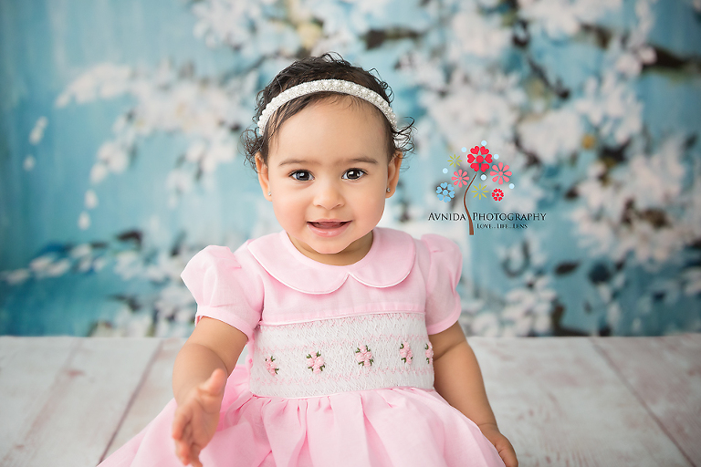 Cake Smash Photography Lawrenceville NJ - Mark of a true princess - The smile, the confidence, the dressing style, all come together with Ella extending her hand out for a hello