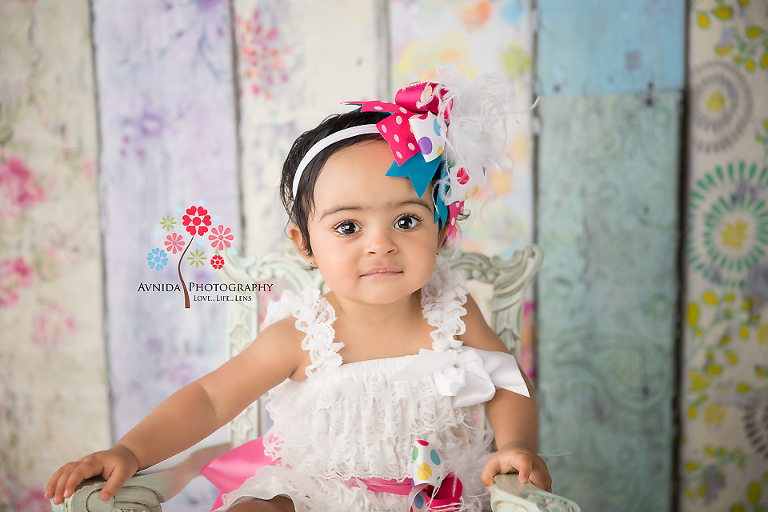 Cake Smash Photography Lawrenceville NJ - This is how you pull off a stylish shabby chic style for the spring party - a colorful headband, a white dress and a cool chair to top it off