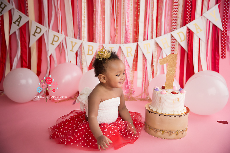 Cake Smash Photography Edison NJ - The kind soul that Morgan is, she gives the cake a little pep talk so she can have the best cake smash pictures