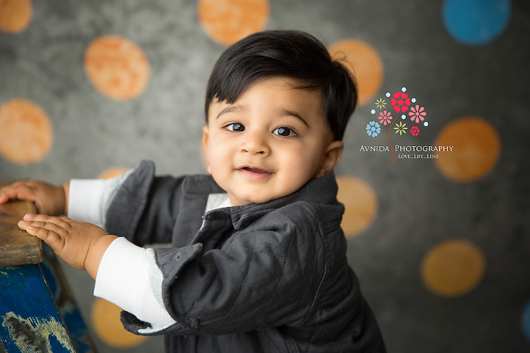 Cake Smash Photography Avalon NJ - I love those chubby little hands and the folded jacket - not to mention the hair - Best Cake Smash Photographer in NJ
