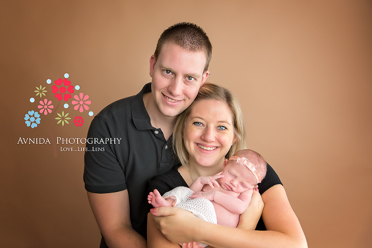 Newborn Photography Somerset County NJ - At first I loved this photo for the smiles from mom and dad - and then I looked closely at Baby Kaylee