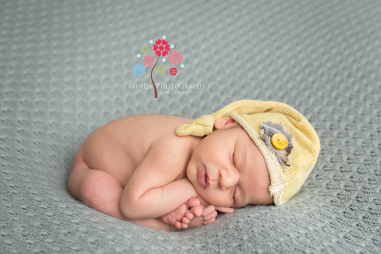 Newborn Photography Chatham NJ - Another cute pose in the grey and yellow - look at the flexibility of Baby Oz - warning for adults - do not try this at home