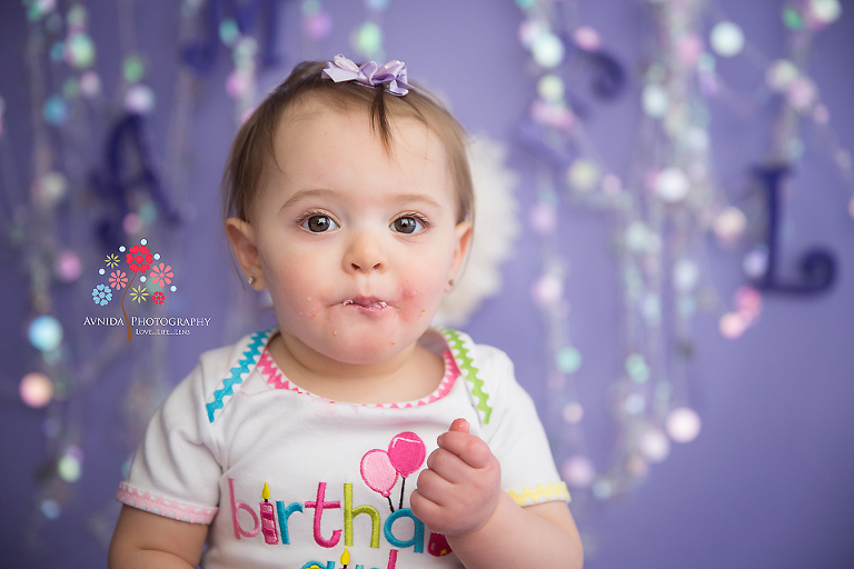 Cake Smash Photography Tewksbury NJ - And finally for the showstopper image - the cutest one of them all - that funny face like she gobbled a big piece of the cake