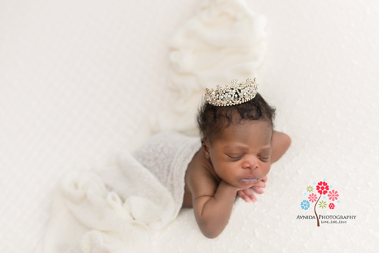 Newborn Photographer Vernon NJ - The crown, the white blanket, the style and the perfect hands on chin pose - if this is not the hallmark of a cute princess then I don't know what it is