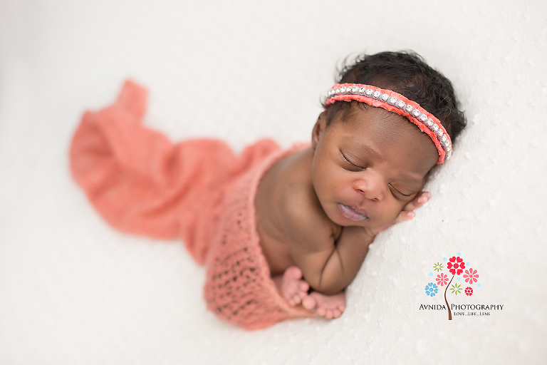 Newborn Photographer Vernon NJ - whether the color is a mild sky blue or a striking orange color - Elena just rocked it with the orange blanket and the orange headband - this girl is a true rockstar.jpg
