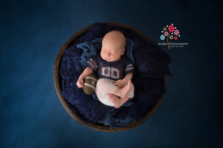 Newborn Photography Hillsborough NJ - When your dad is a NY Giants fan you better learn how to carry a football on you at all times and know how to throw it