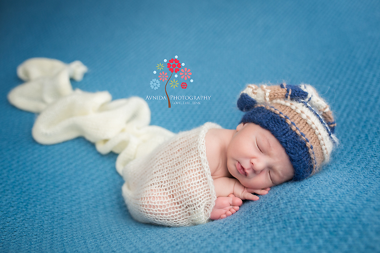Newborn Photography Englewood Cliffs NJ - A cute sleeping baby, colors that are combination of exciting and calm, and lighting that just works