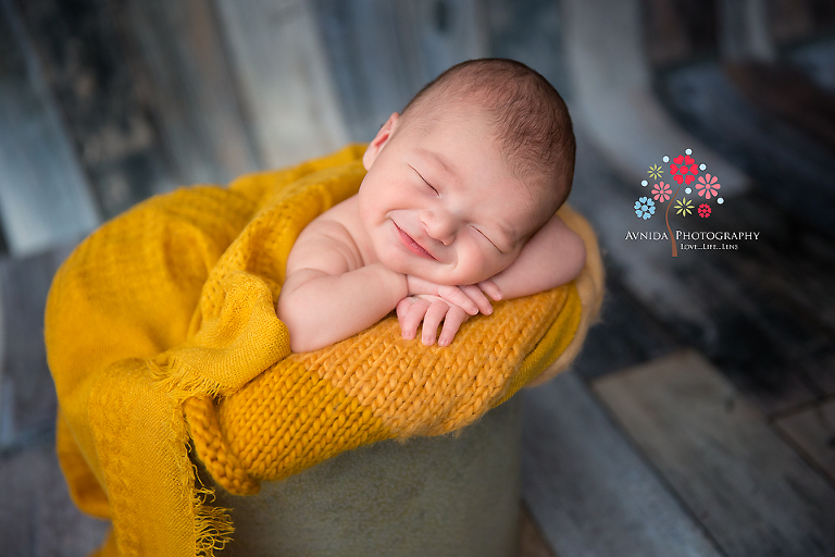 Newborn Photography Englewood Cliffs NJ - A happy smile, a striking color and we have victory ladies and gentlemen - this is one of my favorite photos