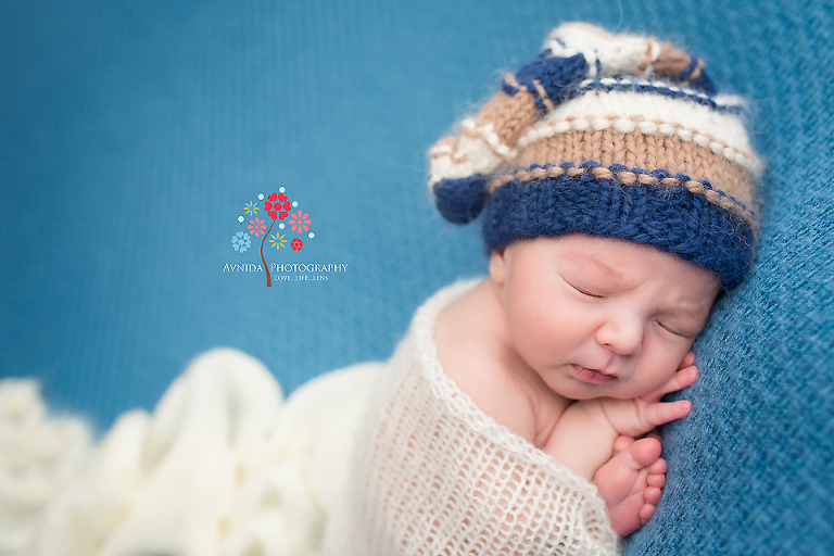Newborn Photography Englewood Cliffs NJ - Someone looks like they are in quite a thoughtful mood - perhaps solving a complex problem in his head