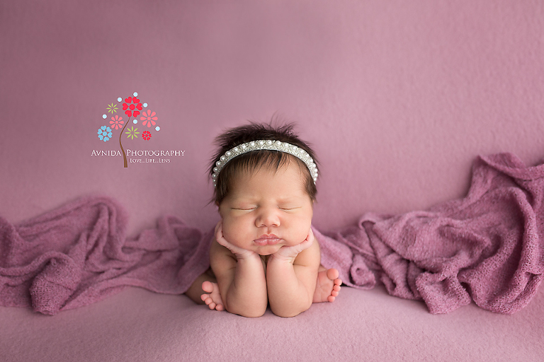Newborn Photography Paterson NJ - The froggie pose executed brilliantly with the blankets spread out in a nice cool fashion - this special shade of purple complements her skin tone so nicely