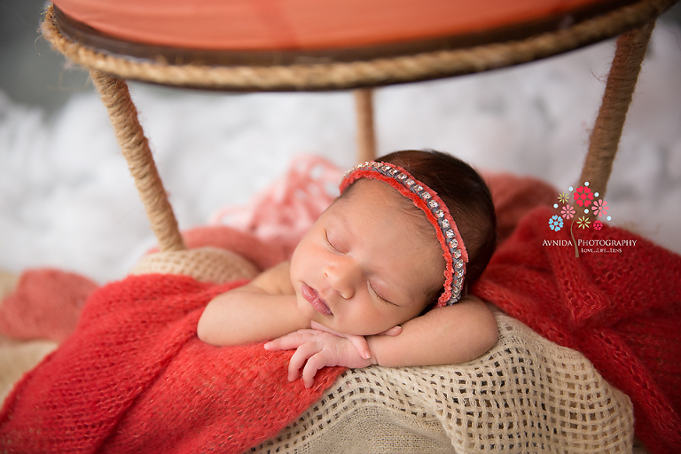 Newborn Photographer Saddle River NJ - Sleeping on cloud nine in her hot air balloon, Baby Anisa takes a little break from her hectic schedule