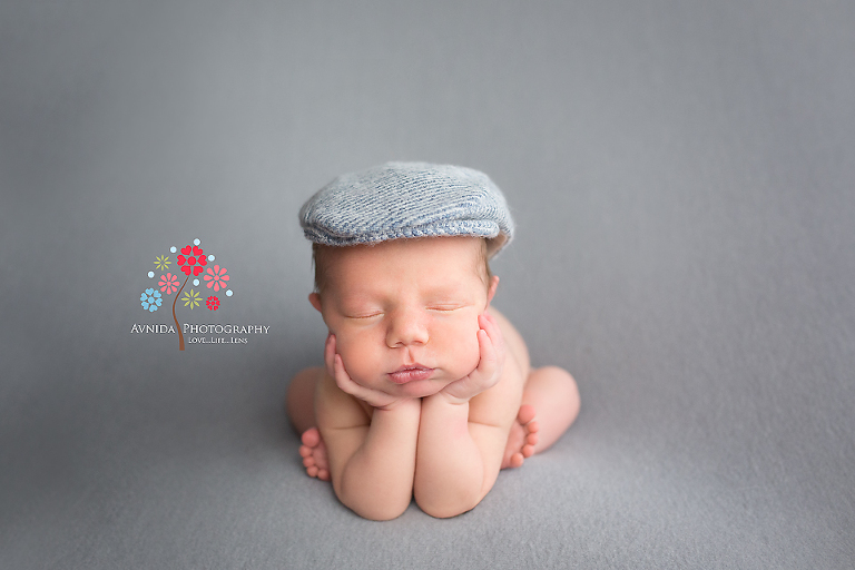 Newborn Photographer Teaneck NJ - from the vibrant orange to the gray cap this suave gentleman knows how to dress to impress - way to go sir, way to go