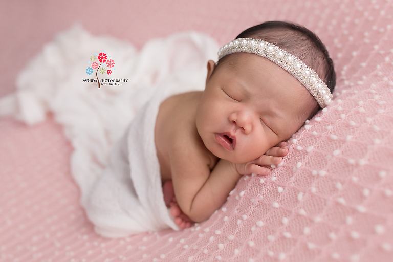 Newborn Photography Lawrenceville NJ - Light Pink and white, two of the most tender colors - best associated with a tender, beautiful baby like Baby Cayla - especially with the headband giving it that extra special touch