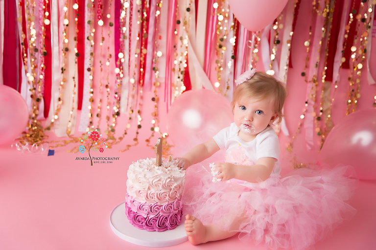 Cake Smash Photography Princeton NJ - And it starts, a slow touch here, a nibble there and before you know it the cake has been smashed into - but we are not complaining because that's exactly what we want