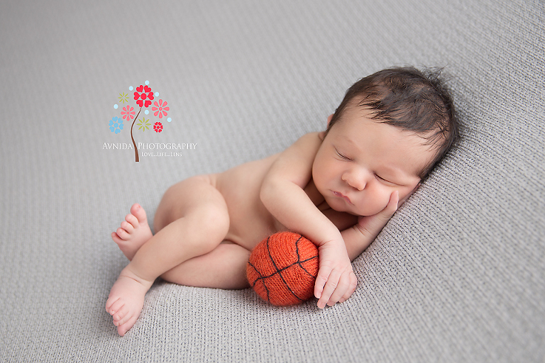 Newborn Photography Red Bank NJ - Dad is a big sports fan and is already waiting for Baby Grayson to grow up to join the family in watching basketball games