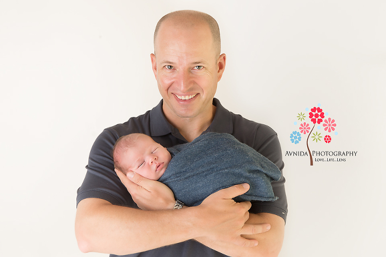 Newborn Photographer Dover NJ - Dad I am seriously in awe of you - you gave the perfect pose, hands criss-crossed in the right posture, gentle support under Eddy's head, and you still managed a great smile - Bravo