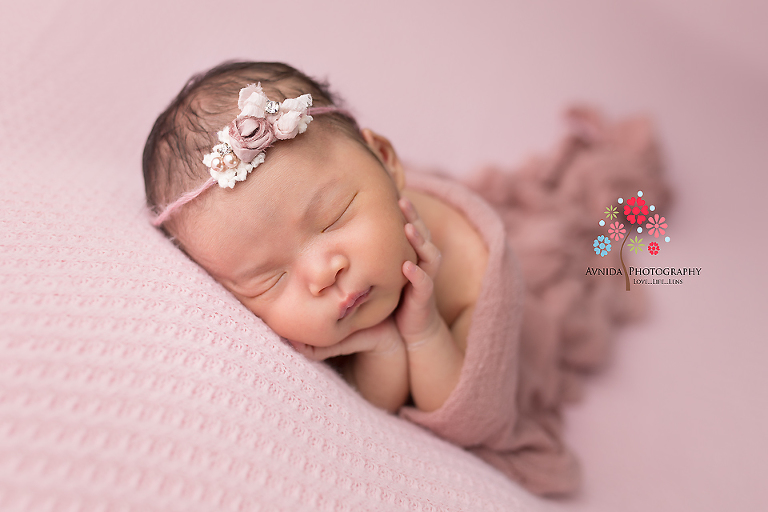 Newborn Photography Flemington NJ - Lying on the side dreaming good dreams, this little girl is the cynosure of her mom's and dad's eyes