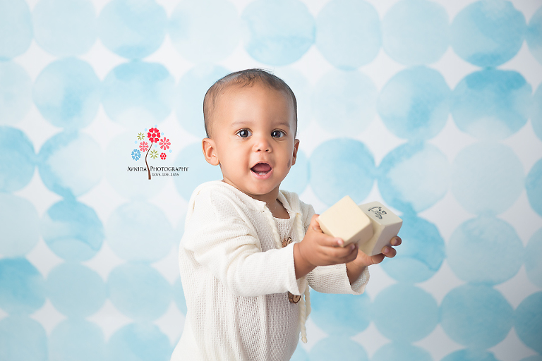 Cake Smash Photography Alpine NJ - Baby Devin loved playing with the blocks - Well it's not a surprise that he is so active - after all dad is a football player