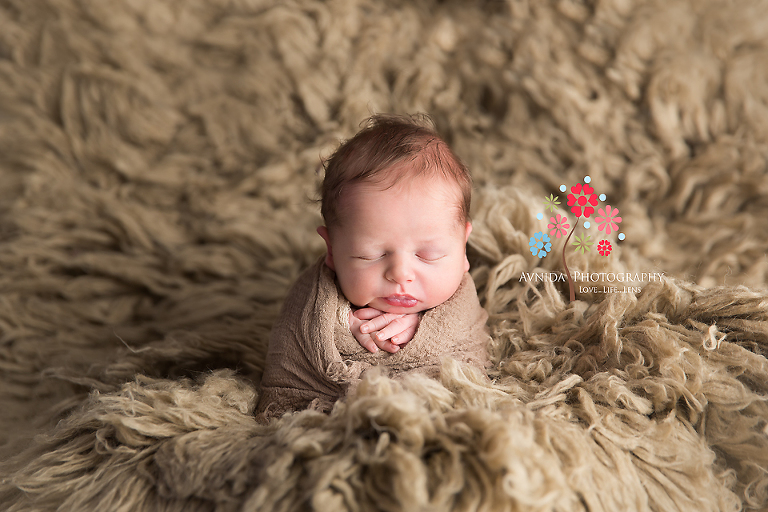 Newborn Photography Millington NJ - A cute little bundle of joy, the brown color reflects closeness to the nature
