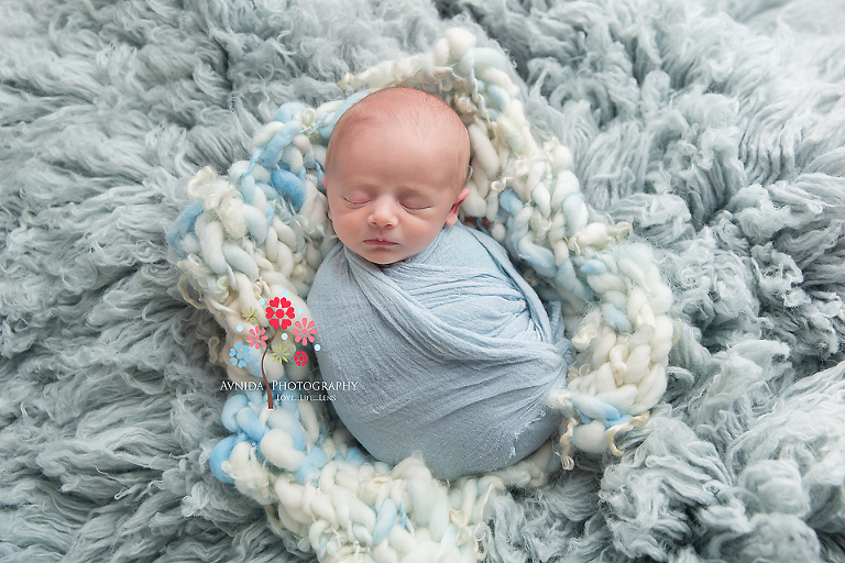 Basking Ridge Newborn Photography NJ - Baby Jackson is one cute bundle of joy floating on a sea of warm blue blankets, what could be more cute