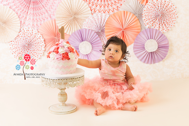 Cake Smash Photography Saddle River NJ - The beauty of the paper pinwheel theme in full display, the colors chosen carefully by our resident designer