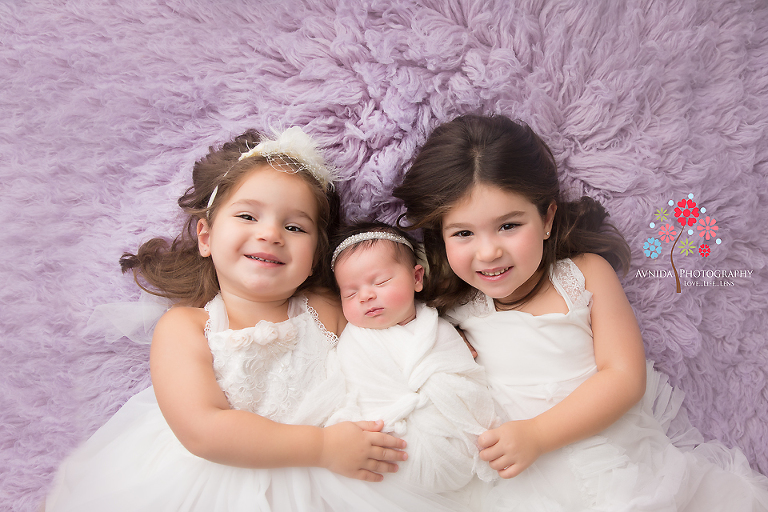 Newborn Photography Spring Lake NJ - Two little angels dressed beautifully in white to celebrate the arrival of the third angel to this world
