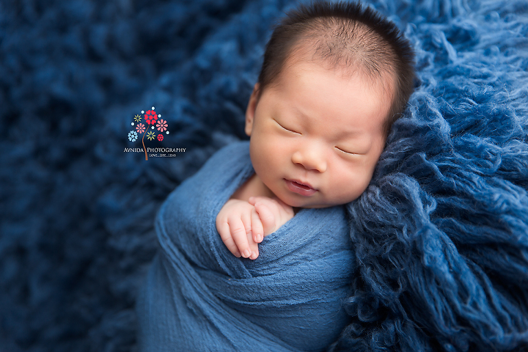 Newborn Photography Franklin Lakes NJ - This photo is just pure bliss - the blues are just perfect and the light from the top right like sunshine shining in