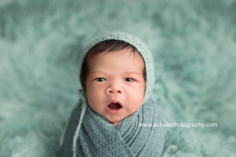 Best Newborn Photographer NJ - baby in green color blanket