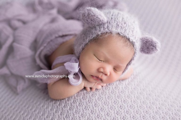 Newborn Photography Northern NJ - Gentle lavender color and a bunny ears cap - gentle and soft