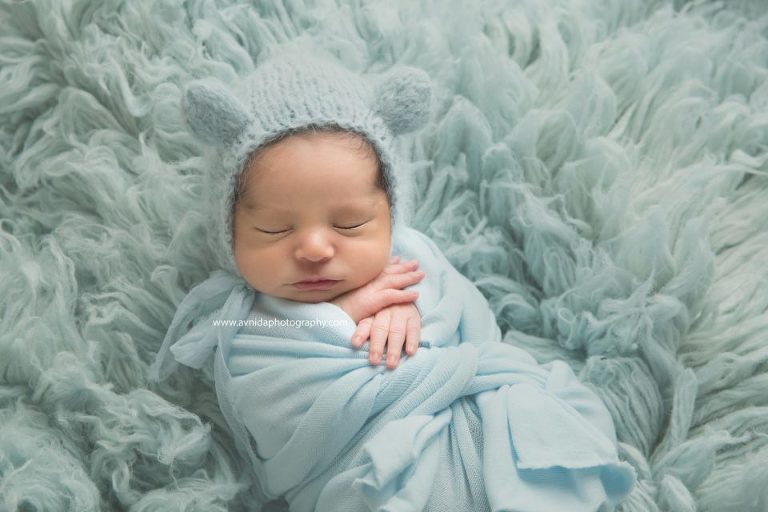 Newborn Photographer Northern NJ - Cute puffy cheeks, little baby fingers and the soft baby blue color