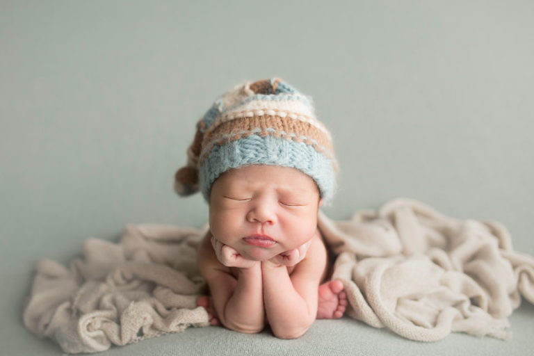 Hands on chin, the worry of the world on his shoulders already.