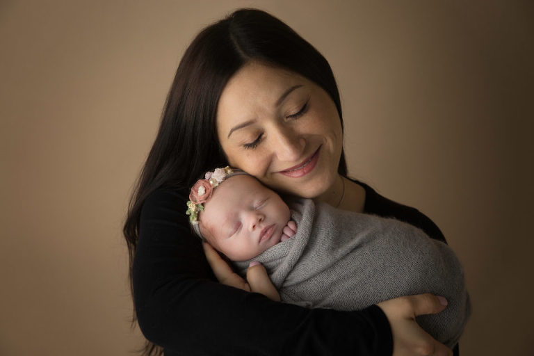 Newborn Photography Cherry Hill NJ - Finally, mom can't resist holding her close to her heart