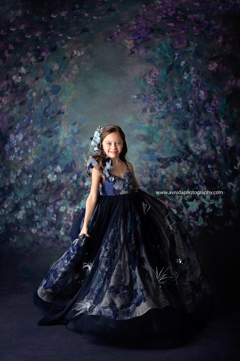 With mesmerizing eyes, our model strikes a perfect pose for the children's couture photography session in New Jersey.