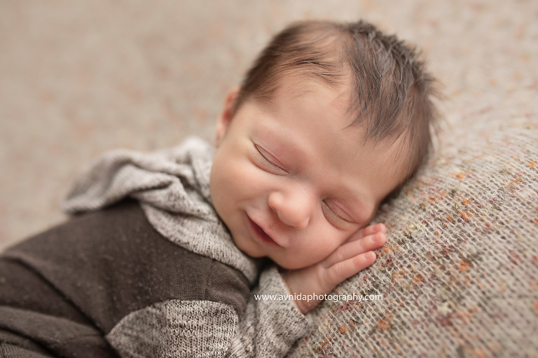 Baby Alex's Newborn Photography Mendham NJ session. What's the best photo during a newborn photo shoot? The one that brings out the smile in the kiddo. And we love that smile.