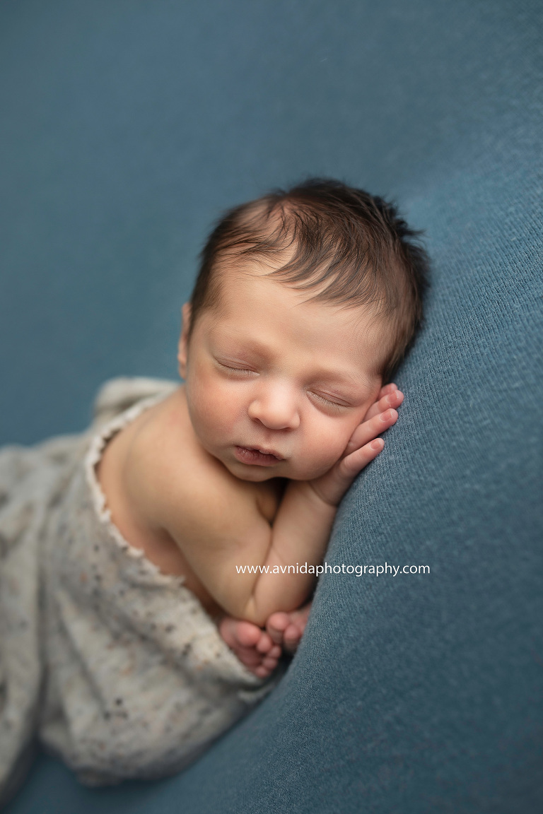 The sideways pose - another calm, relaxed pose for the newborn baby.