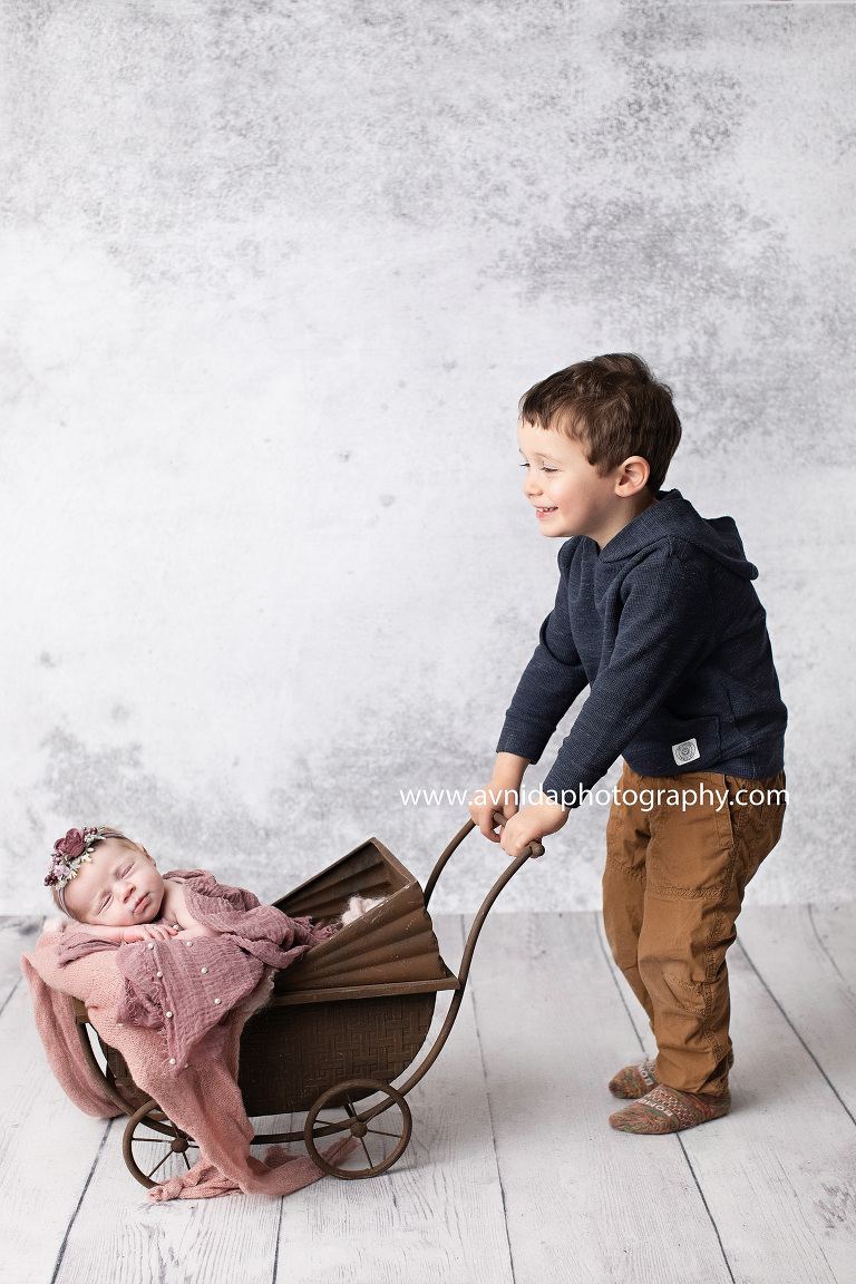 Siblings are the best. Especially if they are as loving as Mackenzie's brother. Big brother loves to take her out for walks in her stroller.