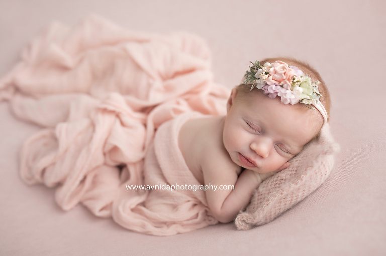 Baby Mackenzie in a combination of pink headband, wrap and blanket. A sight for sore eyes, isn't she?