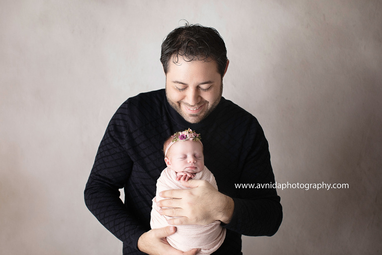 If you had any doubts whatsoever as to how awesome Baby Mackenzie was during her session, this should lay them to rest. Look at how calmly she sleeps in dad's arms.