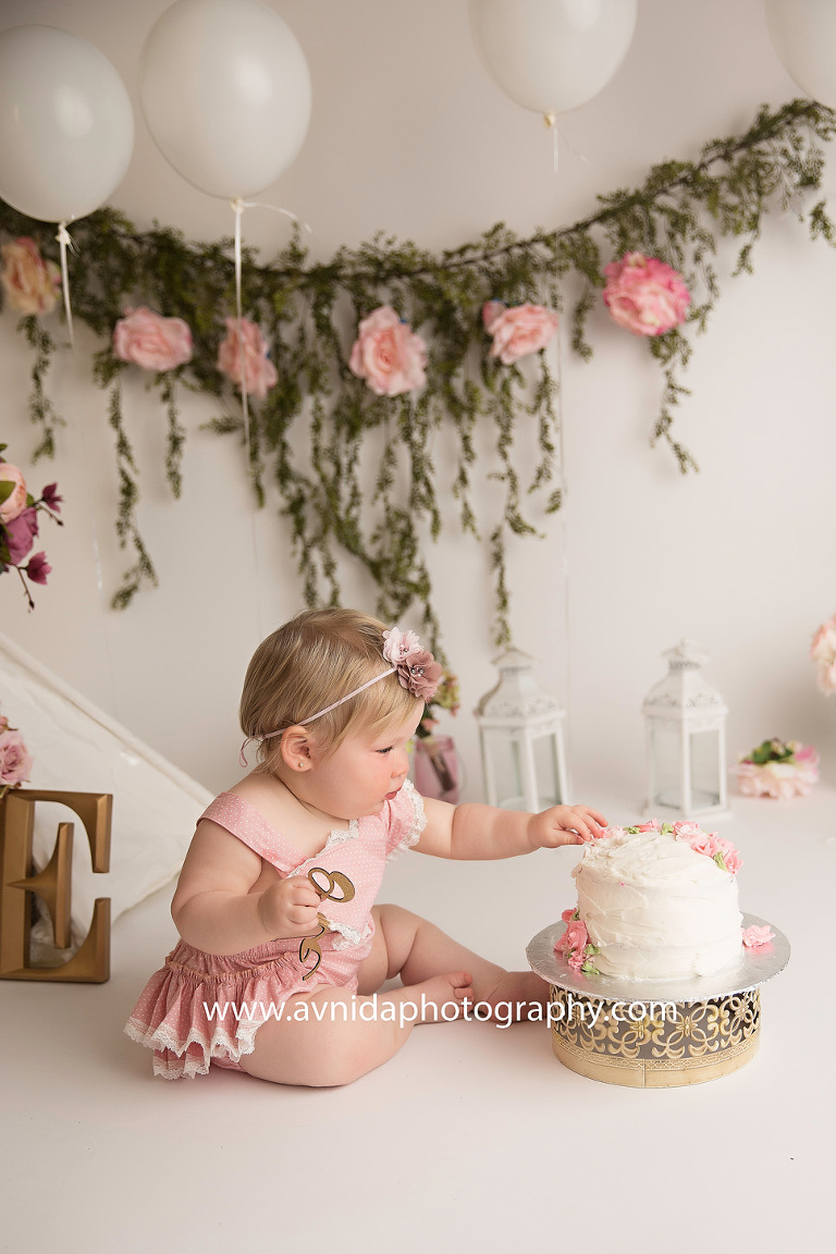 And it begins! One small step for the cake smash, one giant leap for baby kind. This session by the Cake Smash Photographer Morristown NJ is off to a good start.