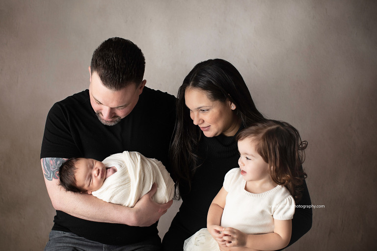 Newborn Photography East Hanover NJ - all eyes on Baby Daniels - the entire family is in love with him and they simply adore him