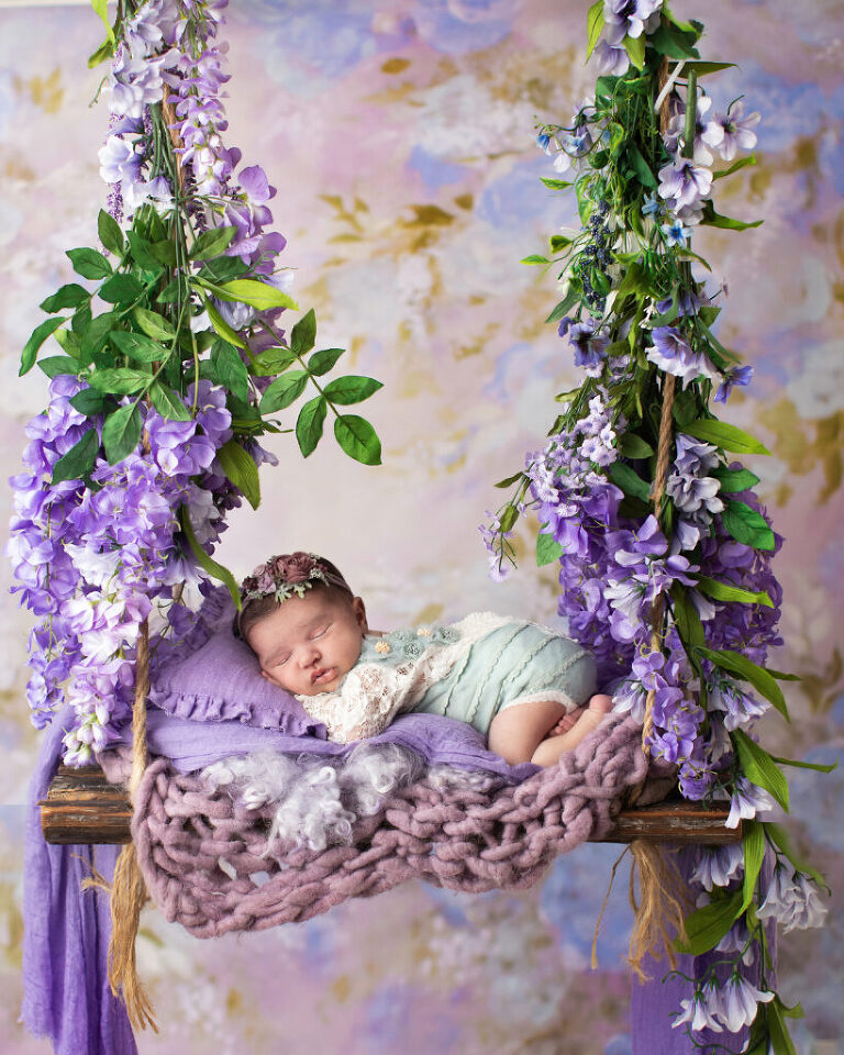 newborn photography morris county nj - sleeping comfortably in the lavender swing